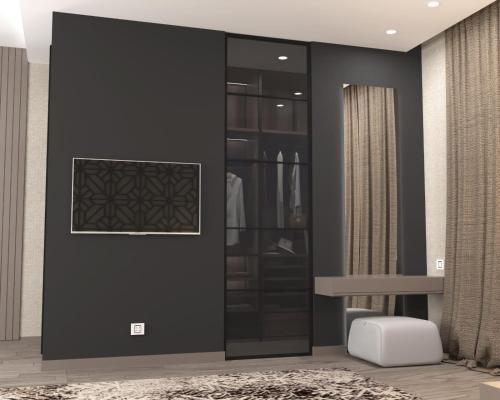 vestidor con pared negra y espejo en VIP Nizami EMIRATES, en Baku