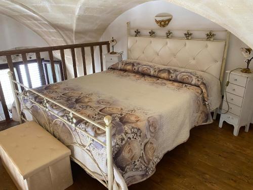 Giường trong phòng chung tại Casa Muscettola