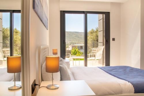 a bedroom with a bed and a balcony at Natur in Izmir