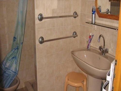 a bathroom with a sink and a shower at Maison Bretignolles-sur-Mer, 4 pièces, 7 personnes - FR-1-324-198 in Bretignolles-sur-Mer