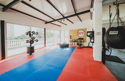 a room with a gym with boxing equipment at Spacious One Bedroom Apartment in Caesar Resort & SPA, Long Beach in Perivolia tou Trikomou