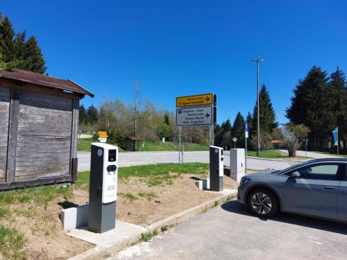 a car parked next to a row of parking meters at Studio "Auszeit wie dahoam" im Predigtstuhl Resort in Sankt Englmar