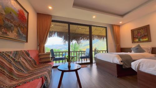 a hotel room with a bed and a balcony at Sapa Eco Villas & Spa in Sa Pa