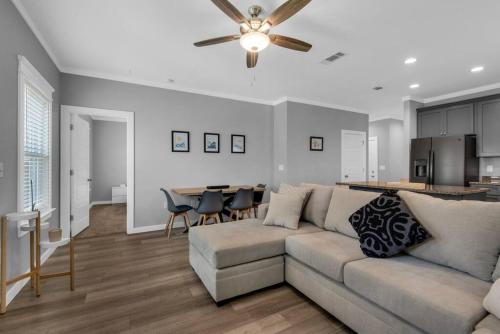 a living room with a couch and a kitchen at Perdido-Parks, Beaches & Close to Downtown 3BR-2BT in Pensacola
