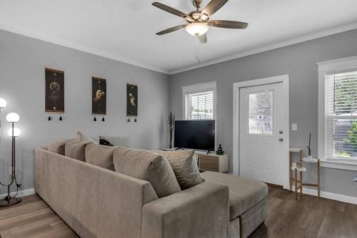 a living room with a couch and a ceiling fan at Perdido-Parks, Beaches & Close to Downtown 3BR-2BT in Pensacola