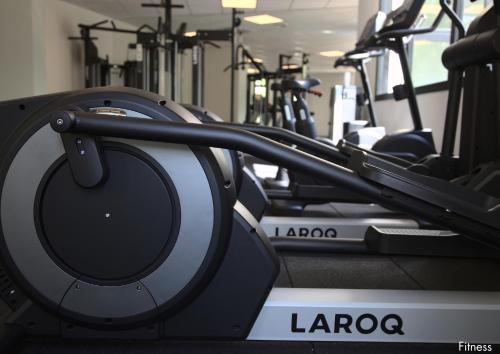 a row of tread machines in a gym at Paxton Paris MLV in Ferrières-en-Brie