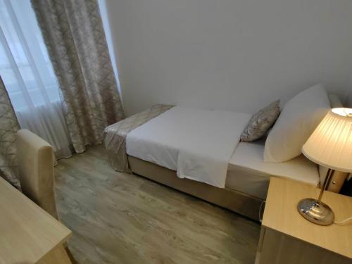 Postel nebo postele na pokoji v ubytování Hotel N