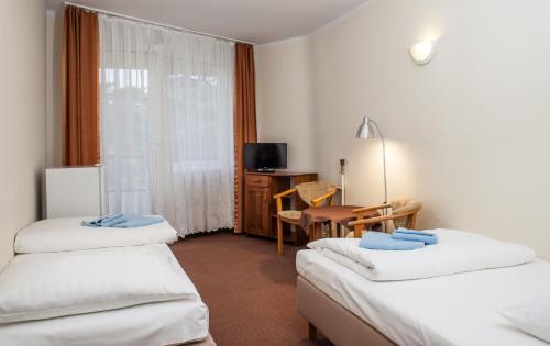 Postel nebo postele na pokoji v ubytování OSW Kaper