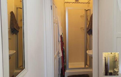 a bathroom with a toilet and a sink and a shower at Charming Studio Sleeps 2 - Kentish Town NWLondon in London