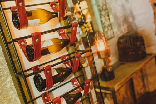 a bunch of wine bottles on a wine rack at Spacious One Bedroom Apartment in Caesar Resort & SPA, Long Beach in Perivolia tou Trikomou