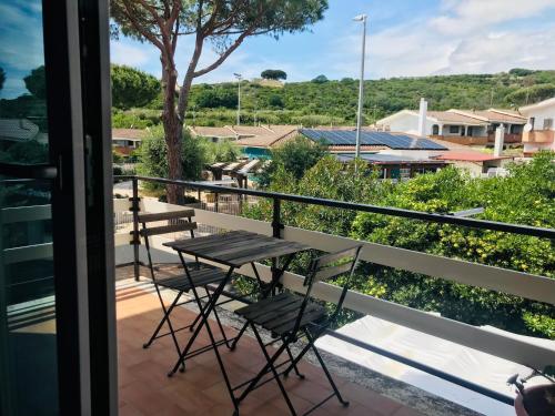 a table and chairs on a balcony with a view at CINQUE OTTAVI B&B in Santa Marinella