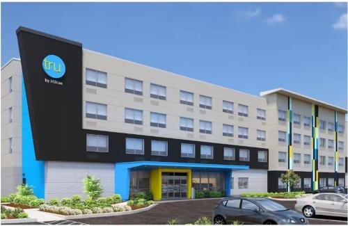 a building with a car parked in front of it at Tru By Hilton Santee in Santee