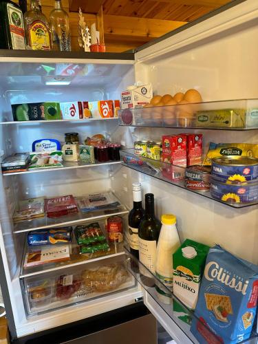 an open refrigerator filled with food and drinks at Lavanda Land - Villa Tanya Mrežnica in Donji Zvečaj