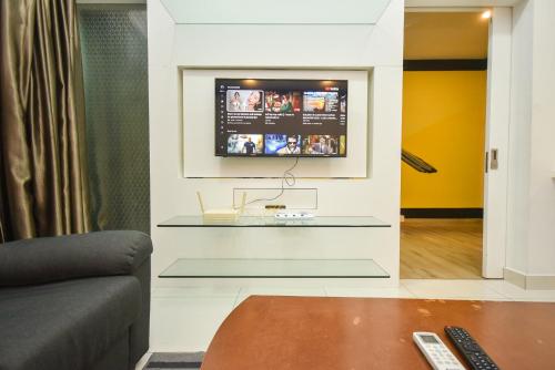 a living room with a tv on a wall at Midvalley Southkey Mosaic Suite by Nest Home in Johor Bahru