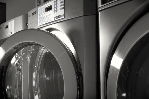 three washing machines sitting next to each other at LOTTE City Hotel Ulsan in Ulsan