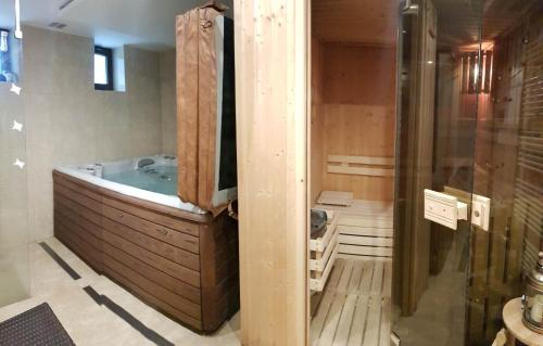 a bathroom with a jacuzzi tub in a room at Vila Jedľa in Smokovce