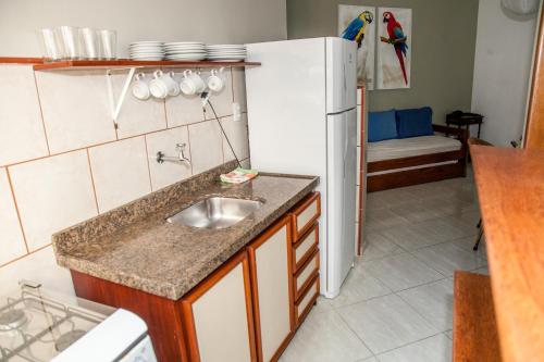 Dapur atau dapur kecil di Residencial Ilha Dourada