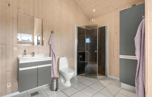 a bathroom with a toilet and a sink and a shower at Gorgeous Home In Tarm With Wifi in Tarm
