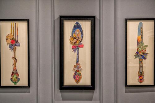 a wall with three framed pieces of art at Ancona e Riviera Luxury b&b in Ancona