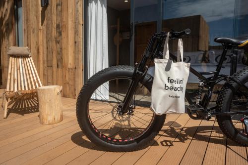 a bike with a bag on the front wheel at LalaGalu - Beachfront EcoCabins in Diani Beach