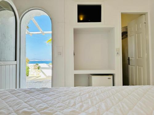 A bed or beds in a room at Paradiso Boutique