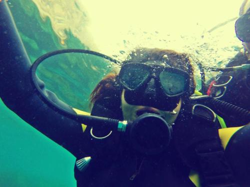 a person wearing a gas mask in the water at Belyounech studio location de vacance in Tetouan