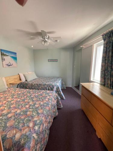 a hotel room with two beds and a window at Barcelona Motel in Wildwood Crest
