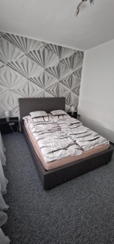 Postel nebo postele na pokoji v ubytování Víztorony apartman