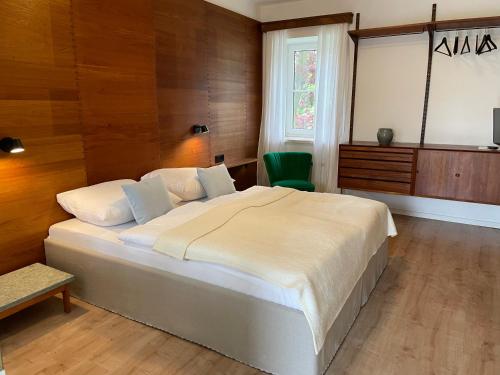 En eller flere senge i et værelse på Weinlandhaus