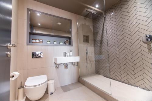a bathroom with a toilet and a sink and a shower at Entire 2 Bed - No. 49 - The Cosy Collection Ltd in York