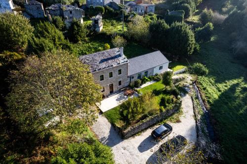 an aerial view of a house with a car parked in front at Xilloi Beach Resort in O Vicedo