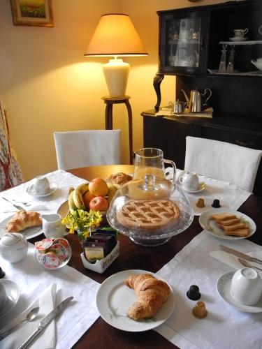 a table with food and bread on top of it at Villa Campo dei Fiori in Casciago