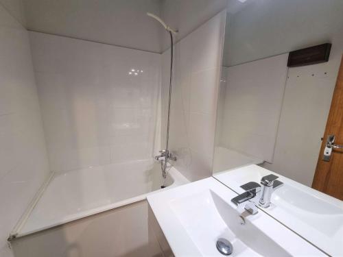 a bathroom with a sink and a shower with a mirror at Studio Saint-Michel-de-Chaillol, 1 pièce, 4 personnes - FR-1-393-131 in Saint-Michel-de-Chaillol