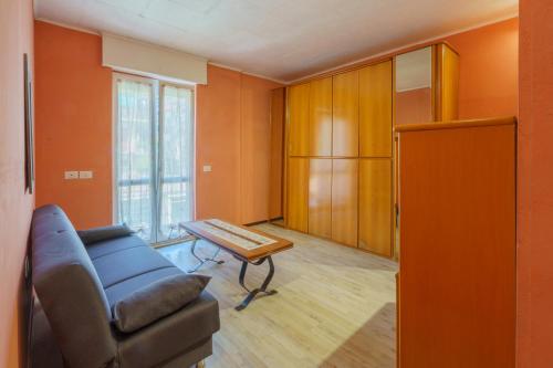 a living room with a couch and a table at The Orange Housing in Como in Como
