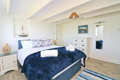 Ліжко або ліжка в номері Coastal retreat surrounded by open countryside