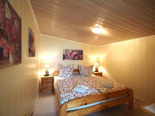 a bedroom with a bed in a room at Rogk, Christa in Zingst