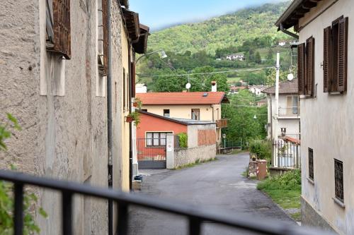 a view from a balcony of a street with buildings at Pin e cele in Dronero