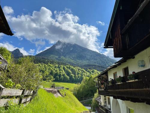 a view of a mountain from between two buildings at Lichtmannegger GmbH und Co KG in Ramsau