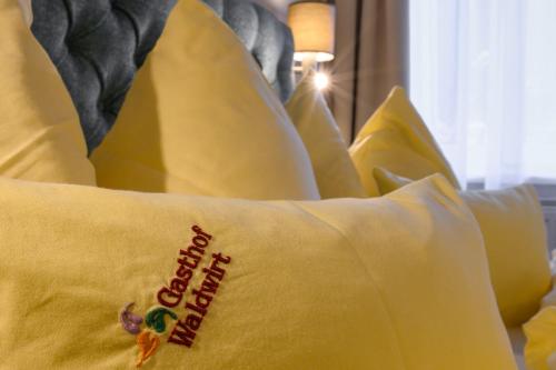 a yellow pillow with the words happy birthday on it at Gasthof Waldwirt in Russbach am Pass Gschütt