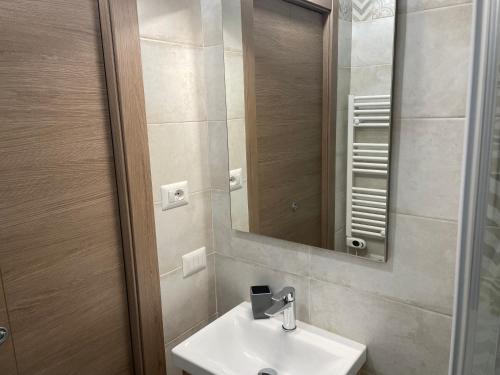 a bathroom with a sink and a mirror at Cà di GIACO in Moneglia
