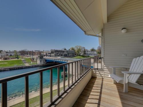 a balcony with a view of the water at 359 Edgewater Inn in Charlevoix