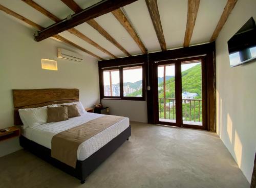 Uma cama ou camas num quarto em Akela Gaira Hotel