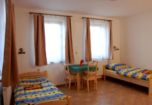 Postel nebo postele na pokoji v ubytování Pension Camp Prager