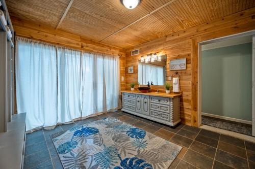 a bathroom with a vanity and a large window at 5BR Combined Units with Hot tub and Grill in Woodstock