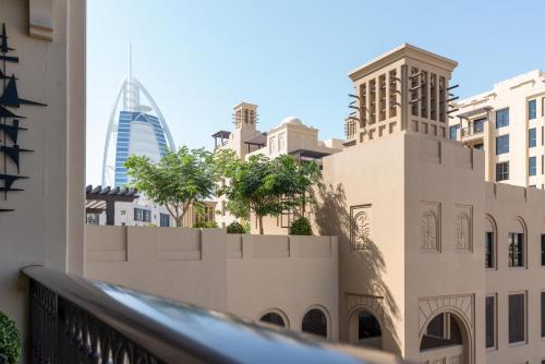 a view of the city from the balcony of a building at Ultimate Stay / Burj Al Arab View / Brand New / Amazing Pool with a View / Perfect Holiday / Madinat Jumeirah / 2 BDR in Dubai