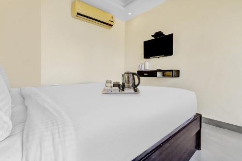 Postel nebo postele na pokoji v ubytování OYO Townhouse 852 Hotel Vachi Inn