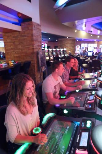 a group of people sitting at a casino at Treasure Bay Casino & Hotel-Adults Age 21 and Above in Biloxi