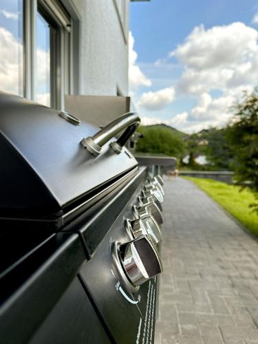 a row of gas burners on the side of a building at NOVA Romantic Luxus Relax Apartments mit Sauna, Nürburgring, Adenauer Forst in Adenau