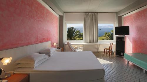 A bed or beds in a room at The Marmara Antalya