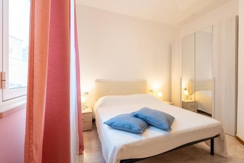 Ένα ή περισσότερα κρεβάτια σε δωμάτιο στο Verdi Bilo Roseto Vacanza